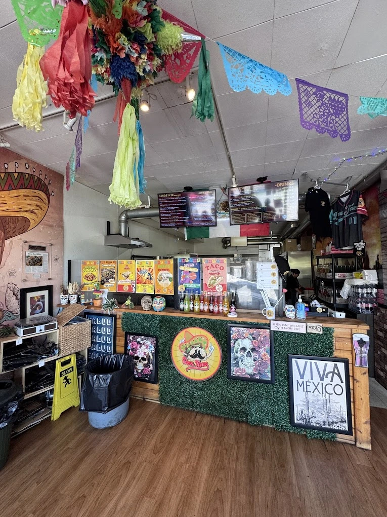 Don Taco Calgary interior order counter with menu boards and Mexican decor